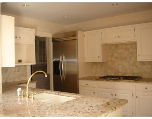 6 Lincoln Road Wellesley, MA 02481 - Photo 3 of 8 a bathroom with a granite countertop sink and a mirror