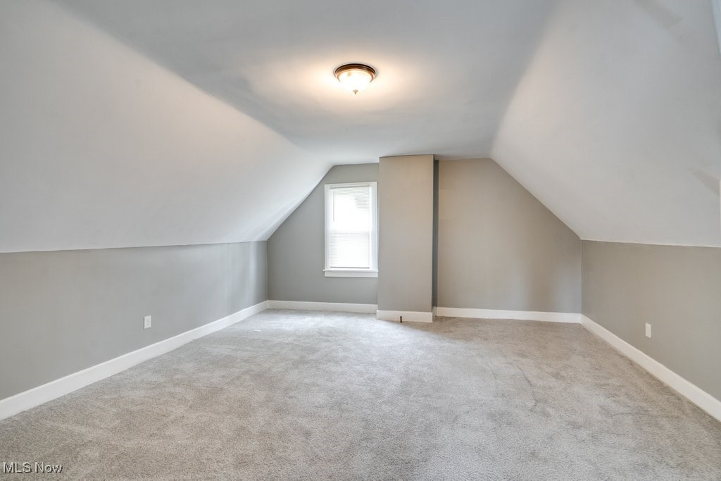 1261 Rozelle Avenue Cleveland, OH 44112 - Photo 27 of 32 Bonus room with light carpet and lofted ceiling