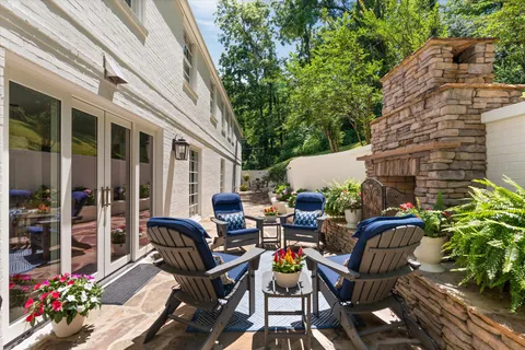 a view of a backyard with sitting area