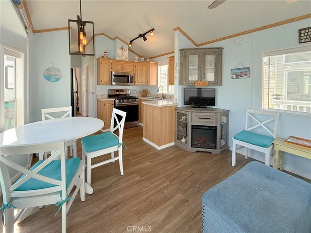 a view of kitchen with dining table and chairs