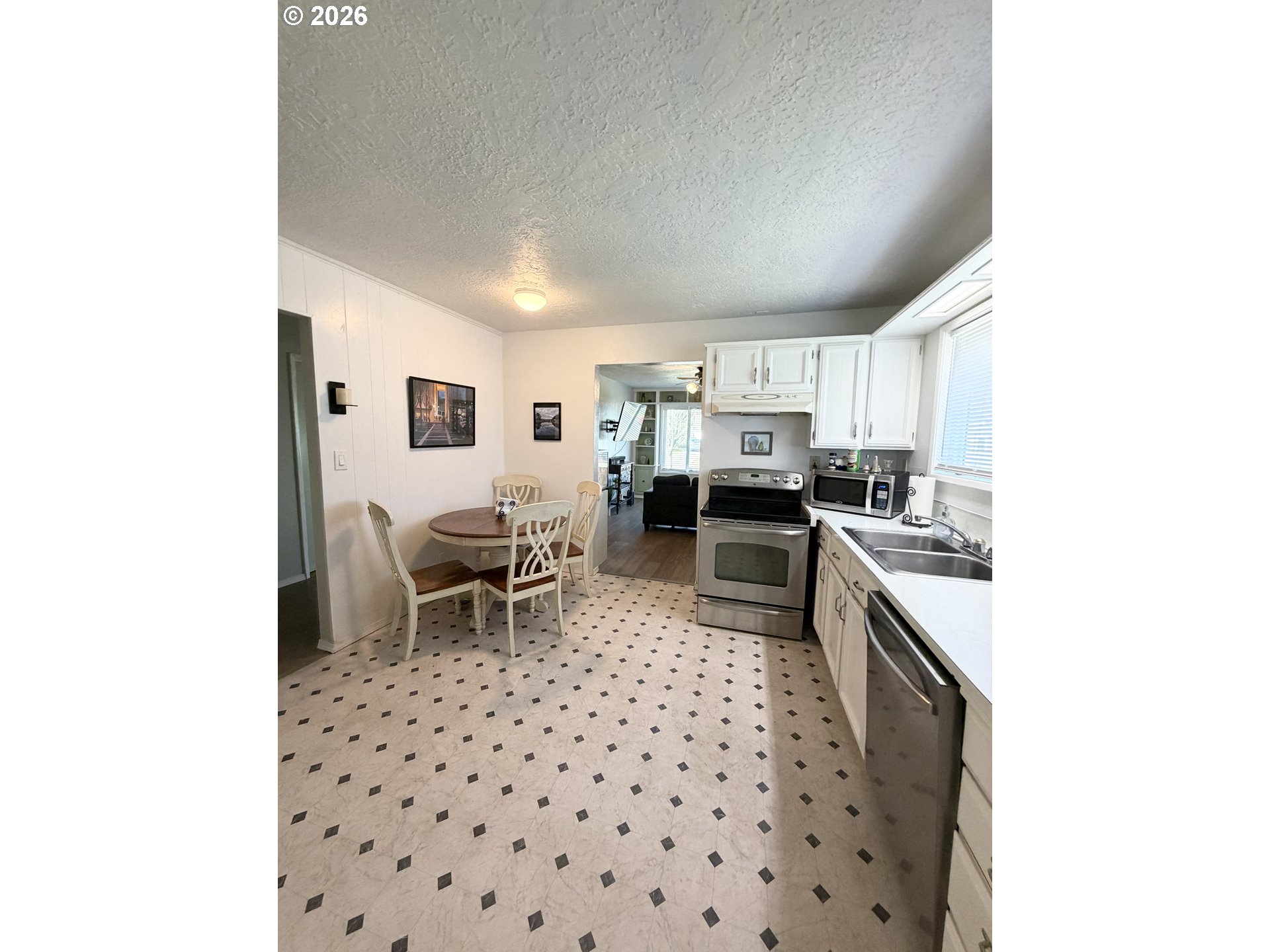 420 24th Avenue Longview, WA 98632 - Photo 12 of 21 a kitchen with a sink and a refrigerator