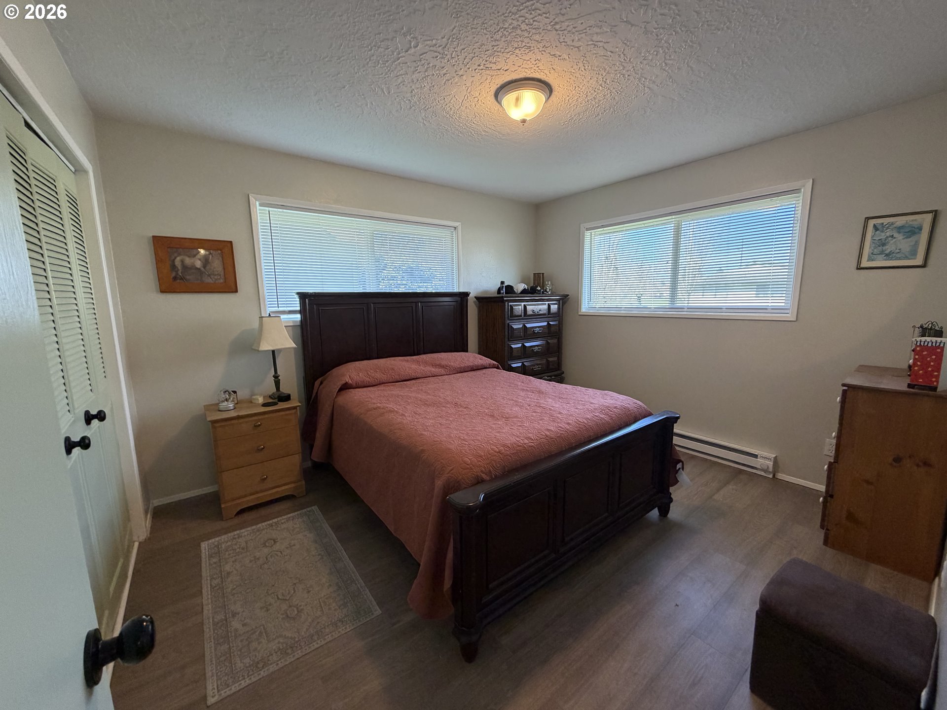 420 24th Avenue Longview, WA 98632 - Photo 5 of 21 a bedroom with a bed and a couch