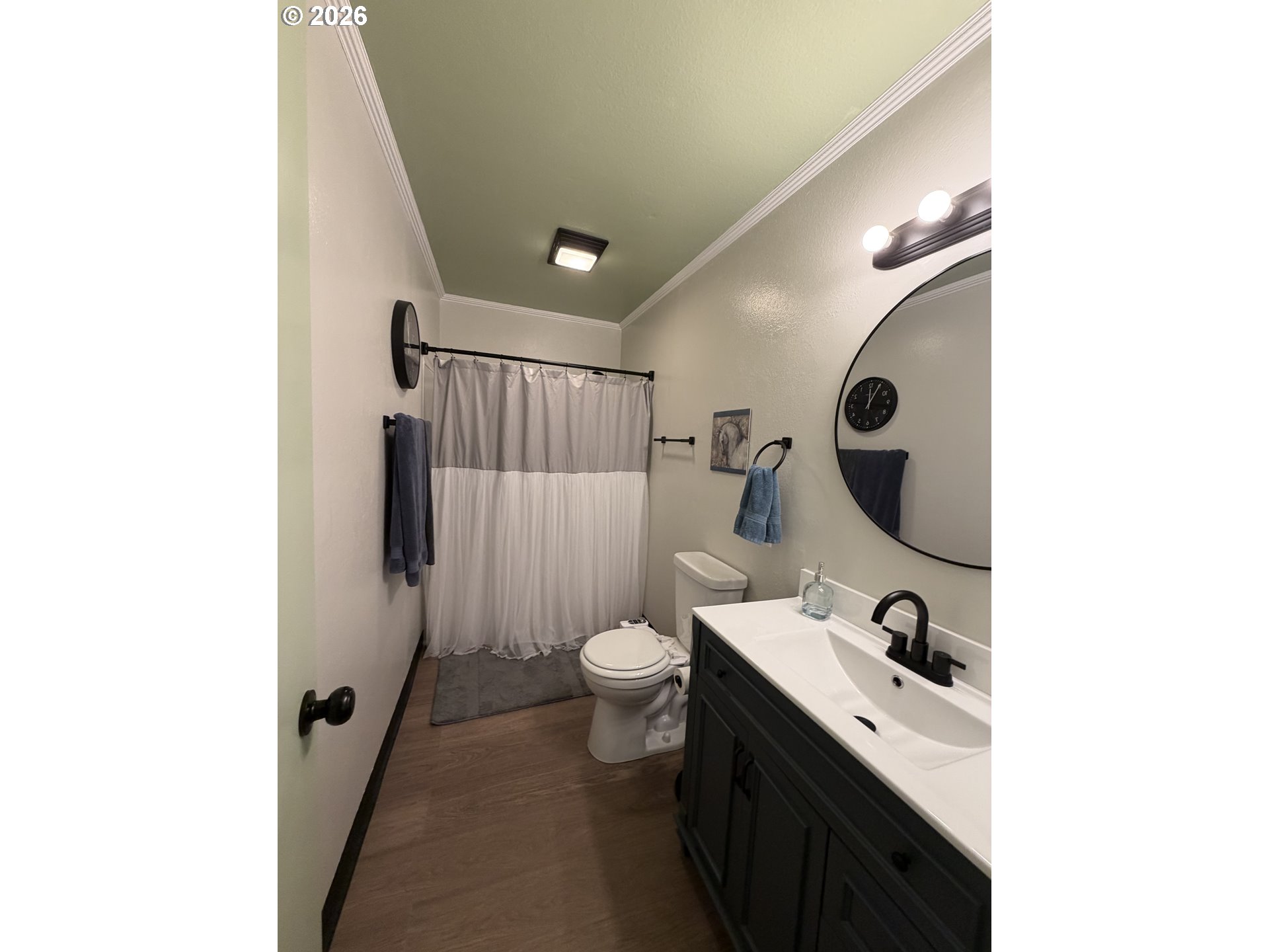 420 24th Avenue Longview, WA 98632 - Photo 7 of 21 a bathroom with a toilet sink and mirror