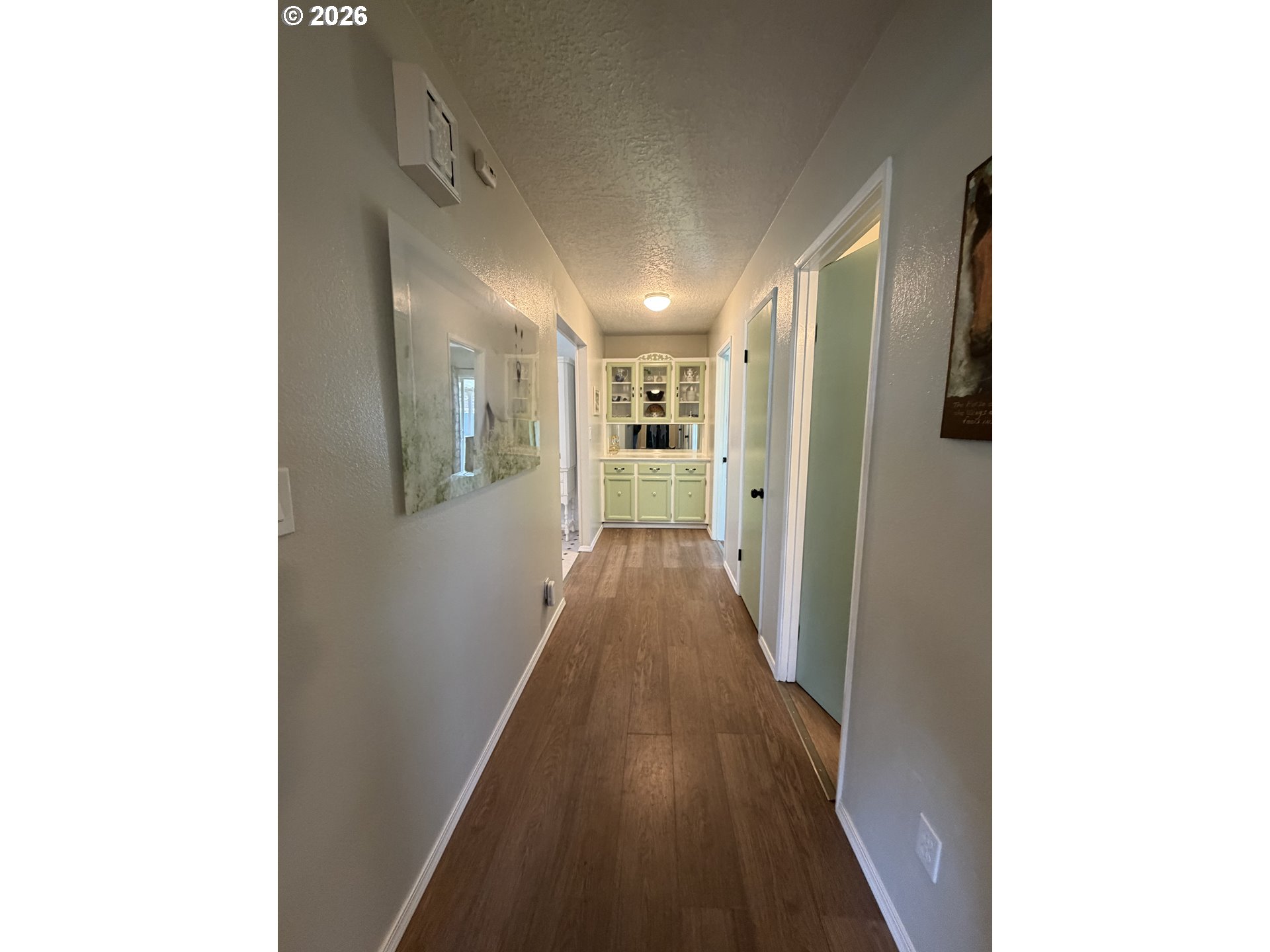 420 24th Avenue Longview, WA 98632 - Photo 8 of 21 a view of a hallway with wooden floor