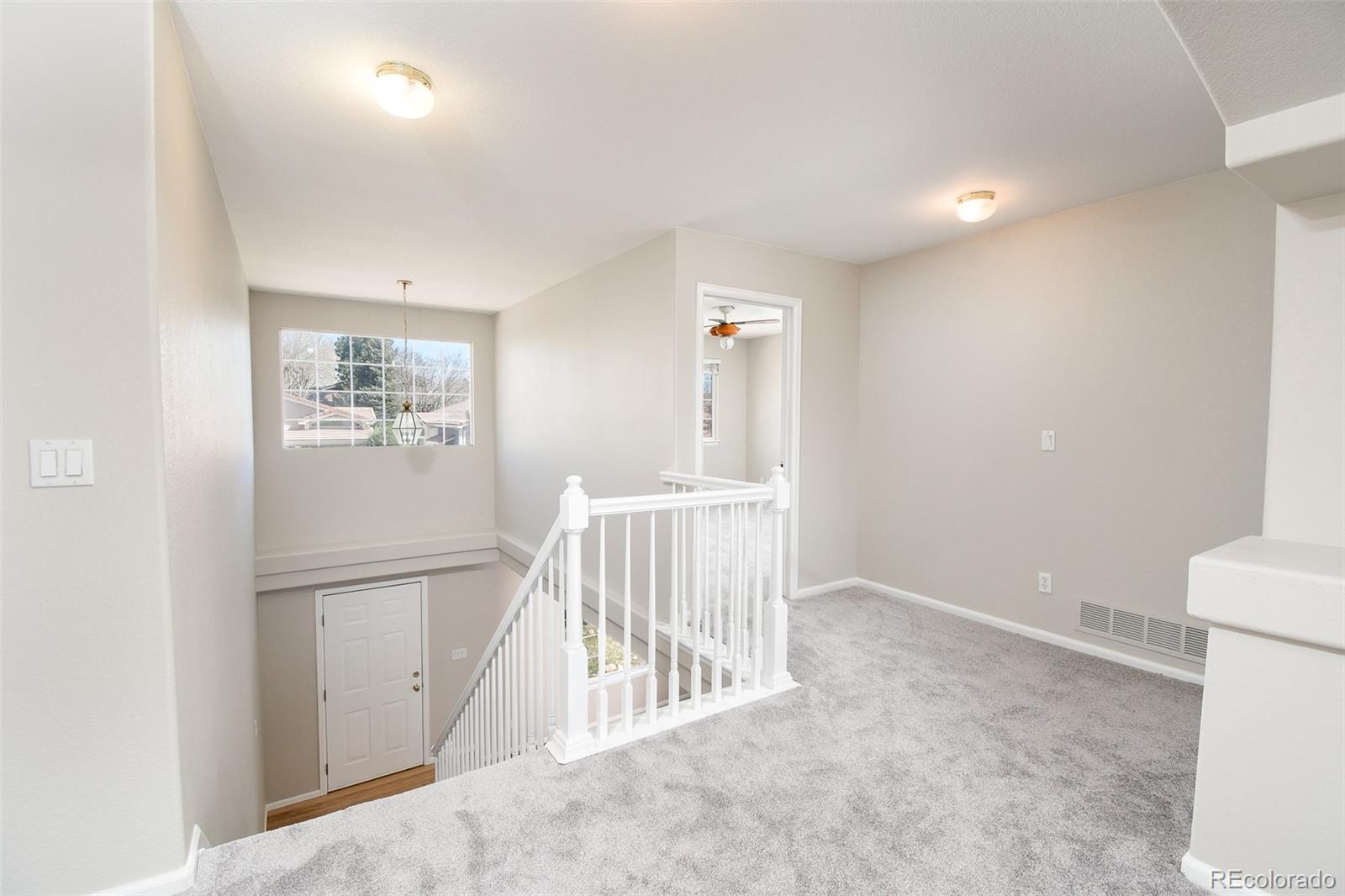 9265 Roadrunner Street Highlands Ranch, CO 80129 - Photo 14 of 28 a view of an empty room with a window