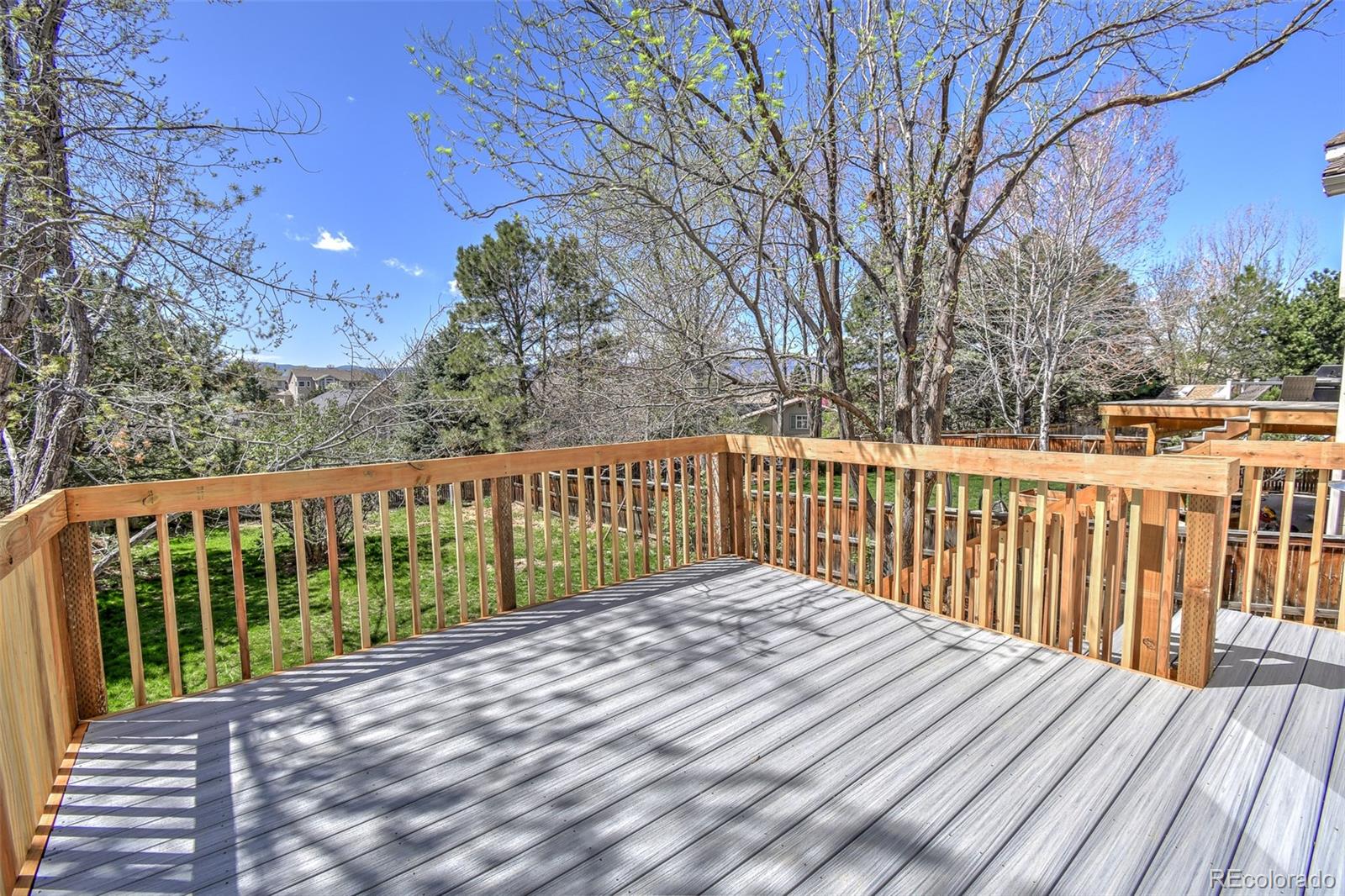 9265 Roadrunner Street Highlands Ranch, CO 80129 - Photo 24 of 28 a view of a wooden roof deck
