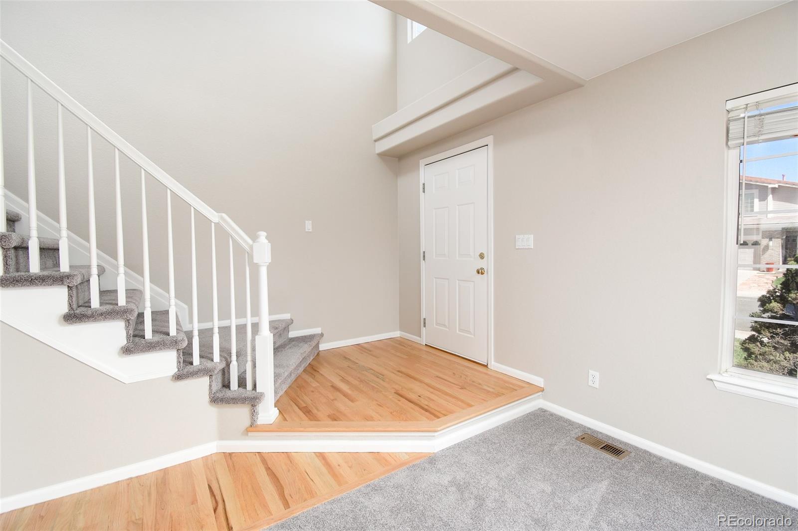 9265 Roadrunner Street Highlands Ranch, CO 80129 - Photo 4 of 28 a view of a bedroom with wooden floor