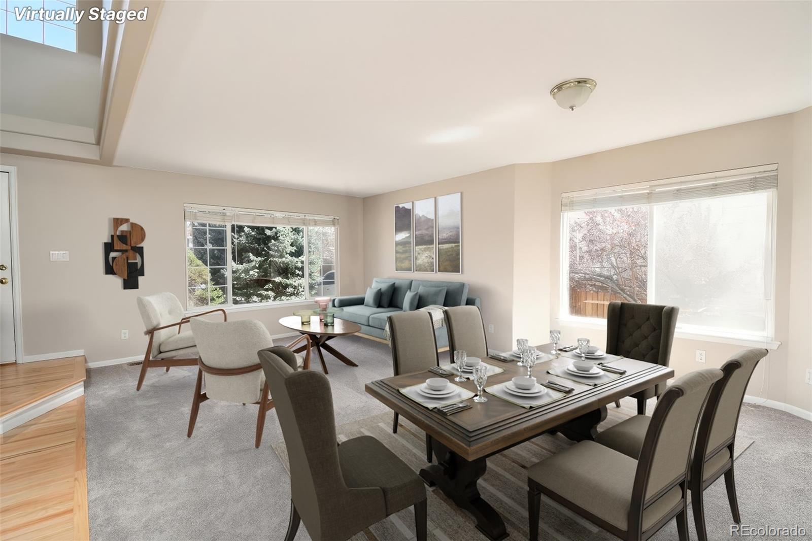 9265 Roadrunner Street Highlands Ranch, CO 80129 - Photo 5 of 28 a view of a dining room with furniture window and wooden floor