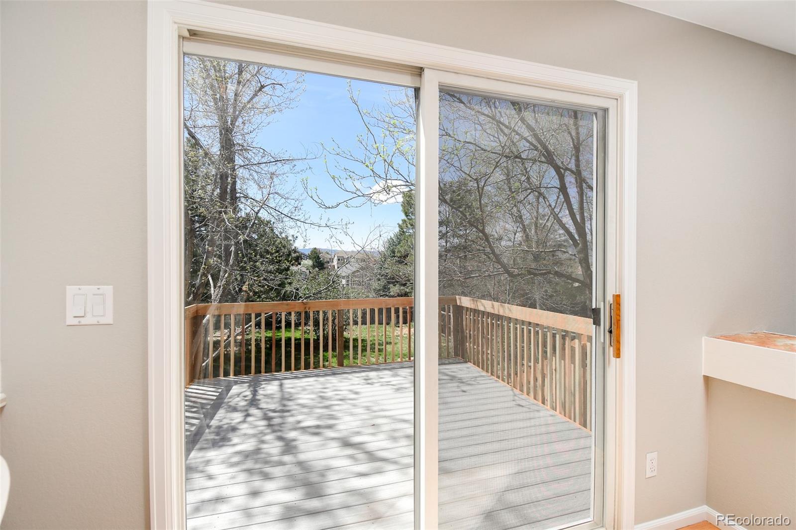 9265 Roadrunner Street Highlands Ranch, CO 80129 - Photo 10 of 28 a view of a wooden floor with a window