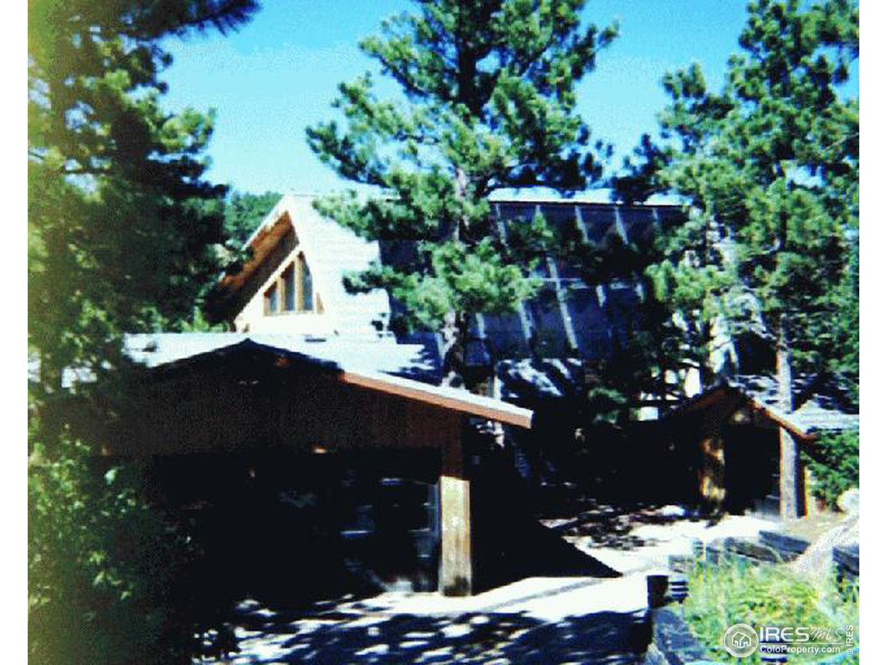 665 Peakview Road Boulder, CO 80302 - Photo 1 of 4 a backyard of a house with lots of green space