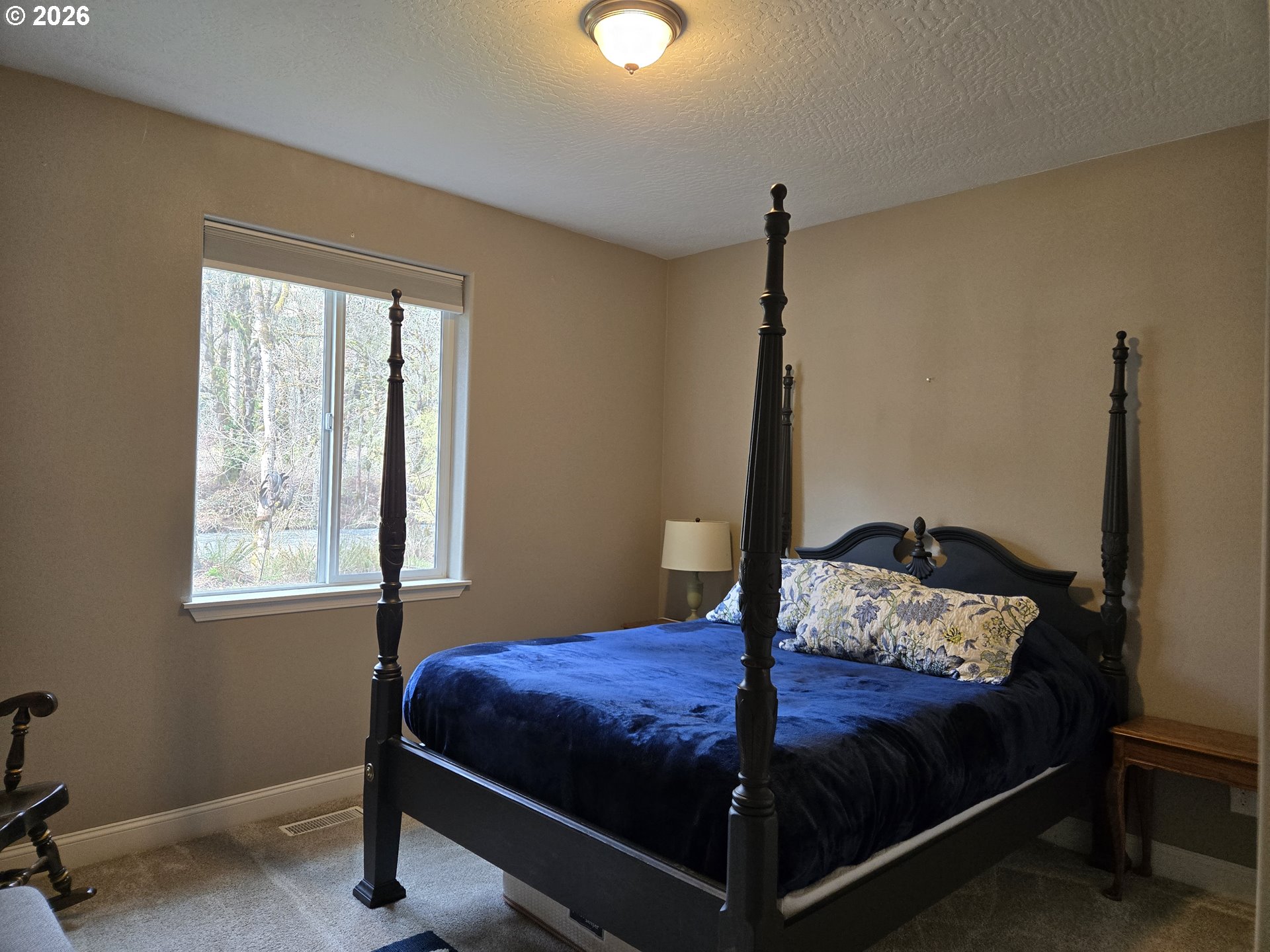 16817 Nonpareil Road Sutherlin, OR 97479 - Photo 13 of 39 a bedroom with a bed and a window