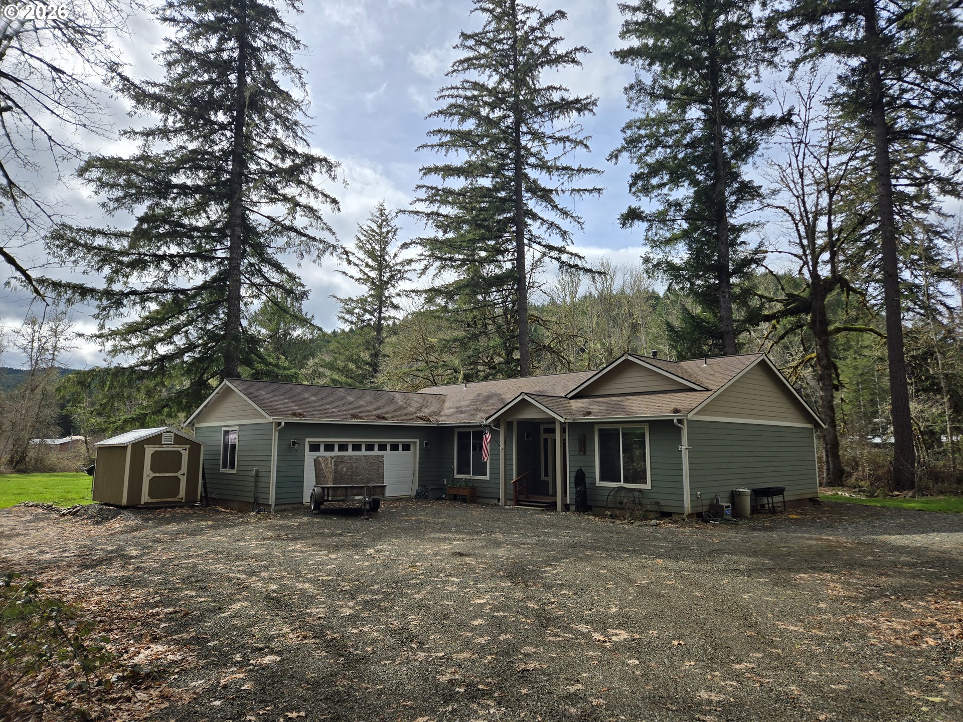 16817 Nonpareil Road Sutherlin, OR 97479 - Photo 2 of 39 a front view of a house with a garden