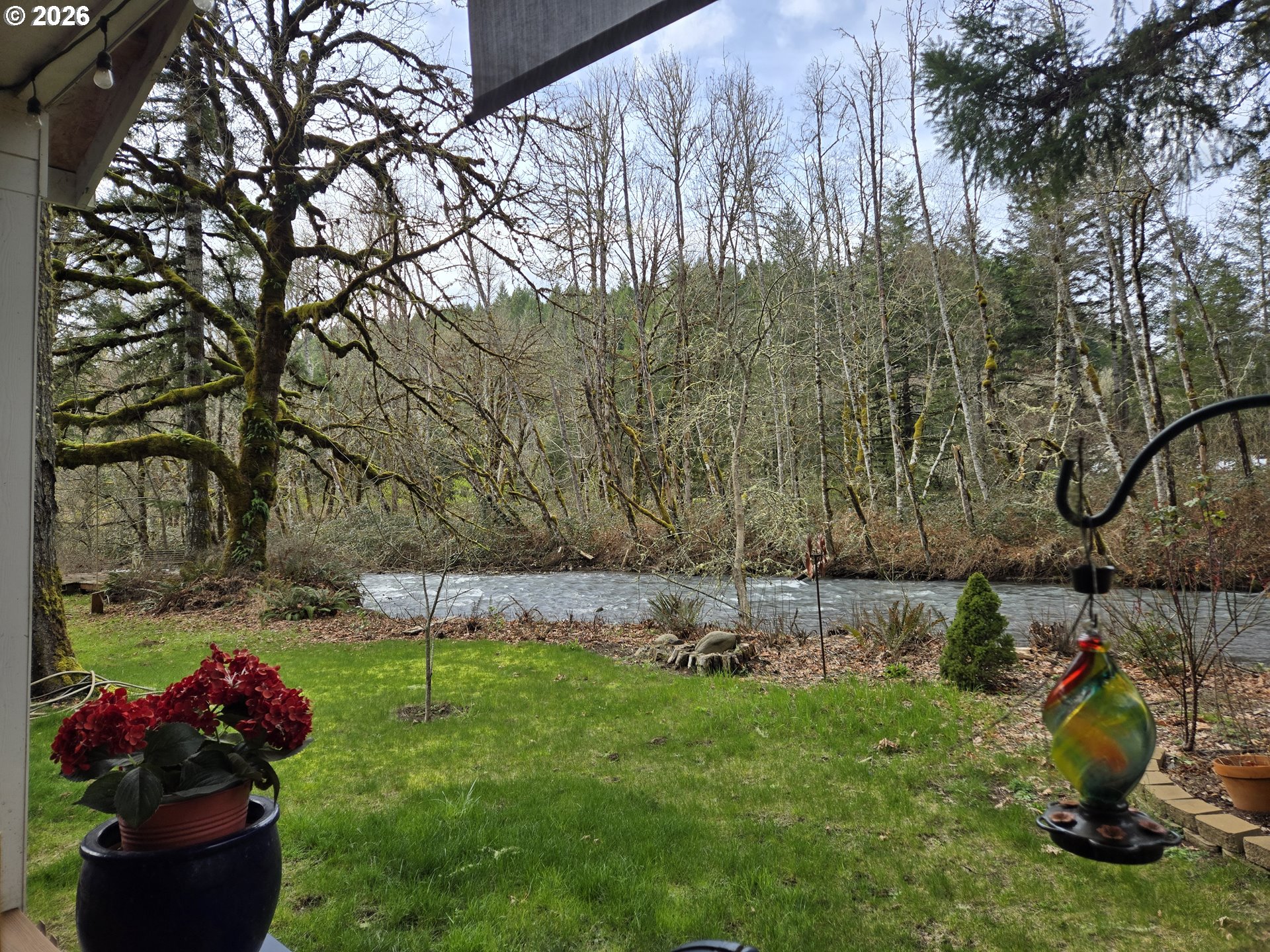 16817 Nonpareil Road Sutherlin, OR 97479 - Photo 24 of 39 a view of a backyard with plants and a patio