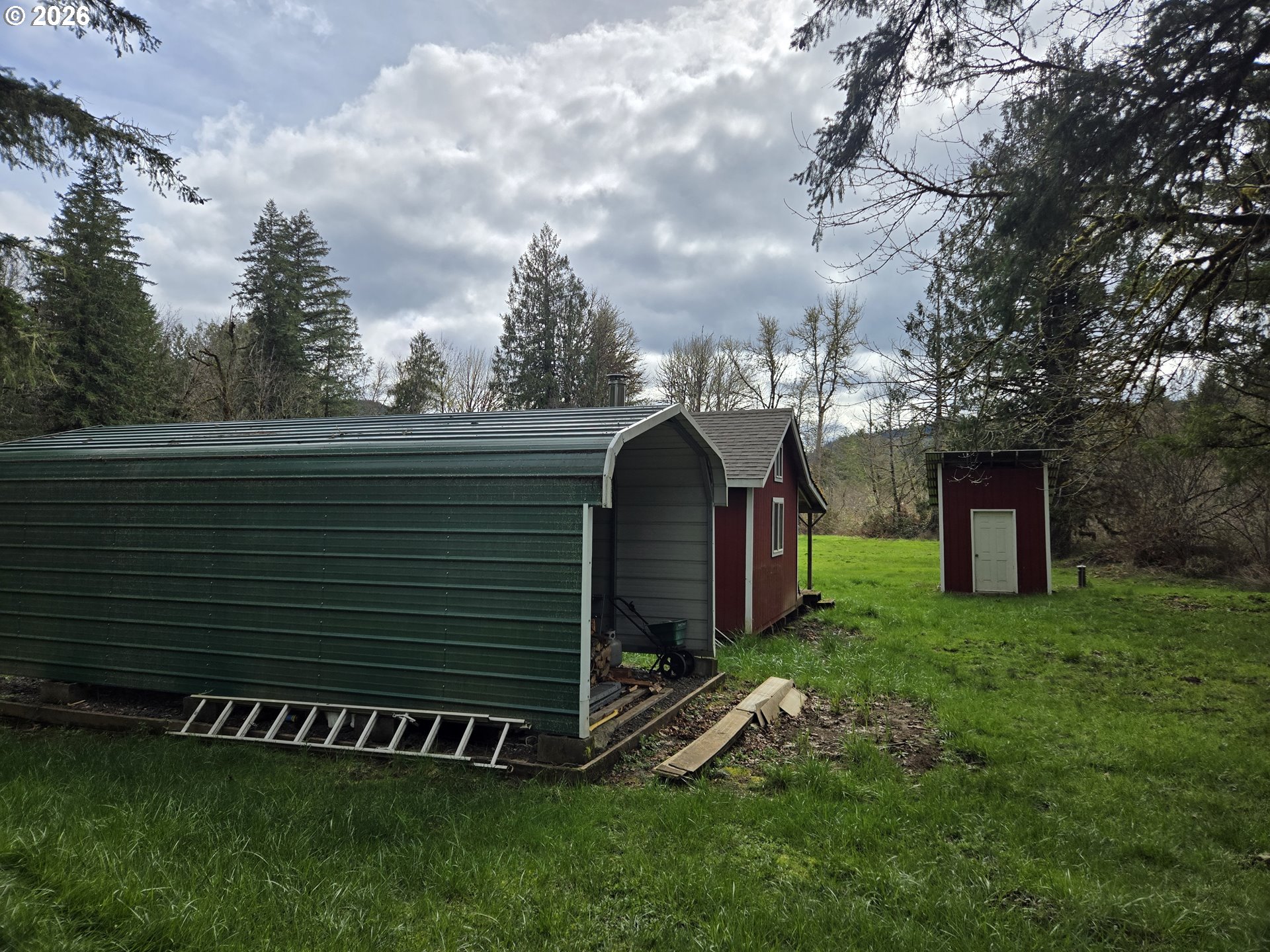 16817 Nonpareil Road Sutherlin, OR 97479 - Photo 25 of 39 a view of a house with a yard