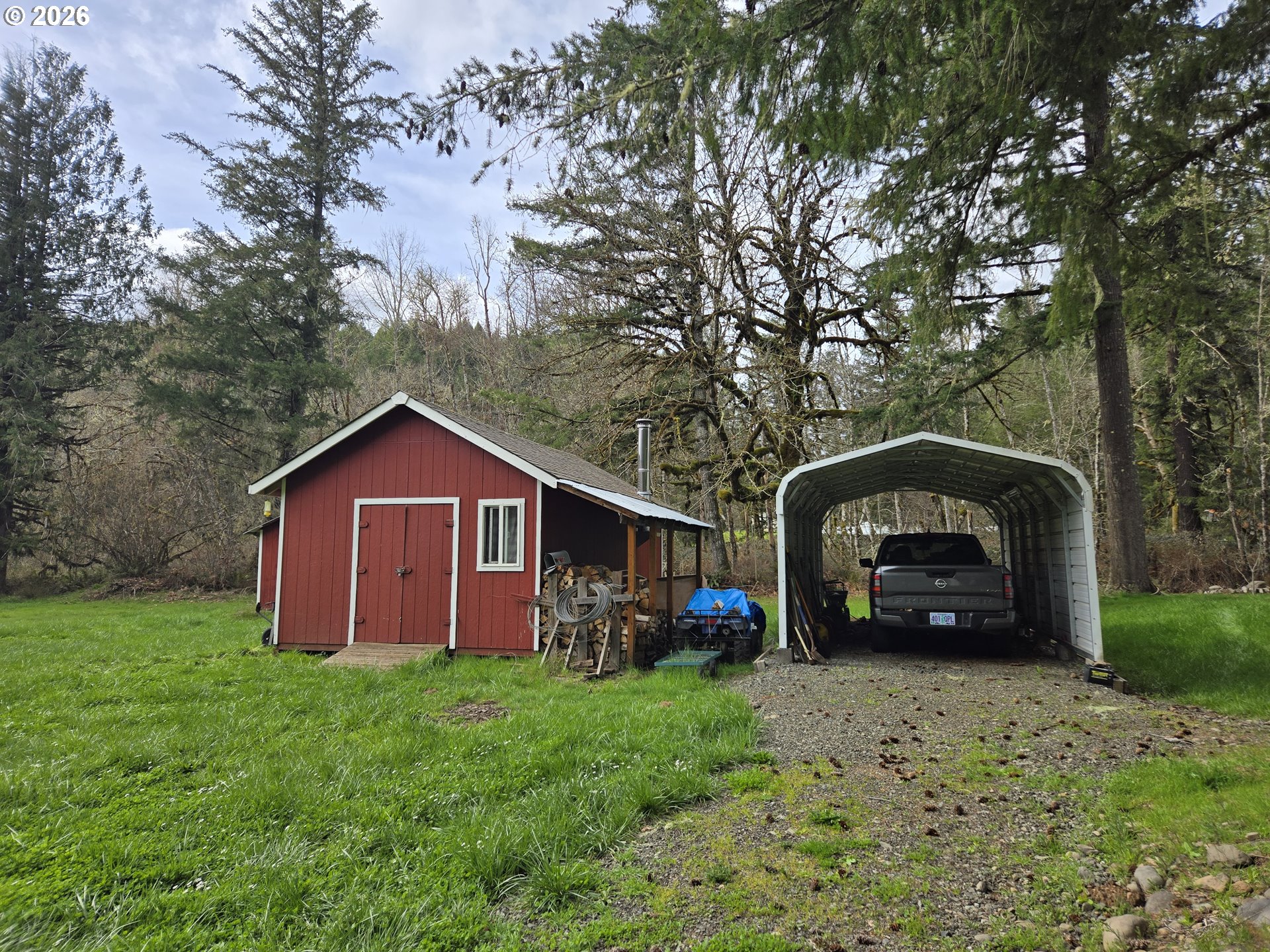 16817 Nonpareil Road Sutherlin, OR 97479 - Photo 28 of 39 a view of a car parked in front of a house with a small yard