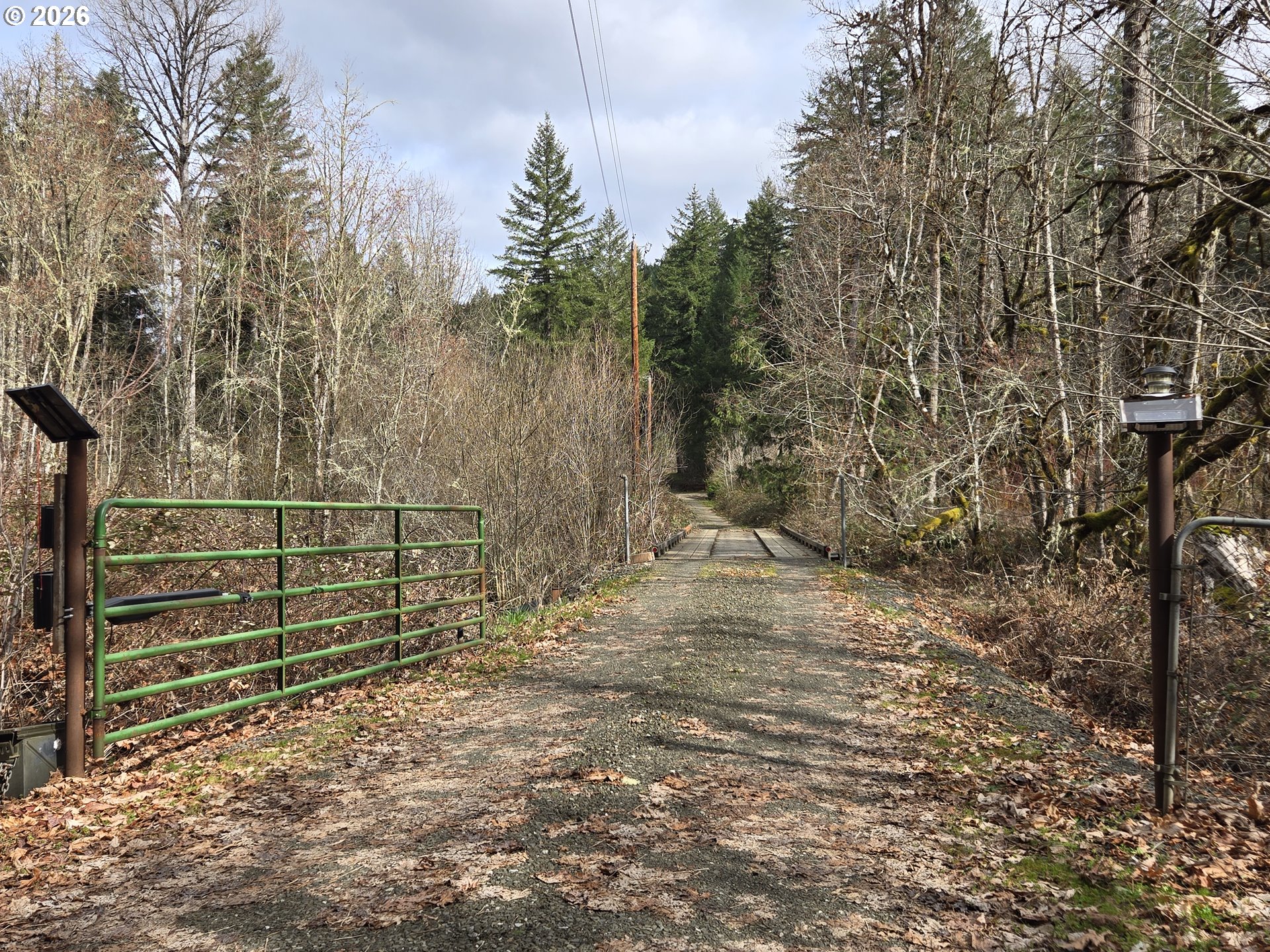 16817 Nonpareil Road Sutherlin, OR 97479 - Photo 38 of 39 a view of a backyard with wooden fence and trees