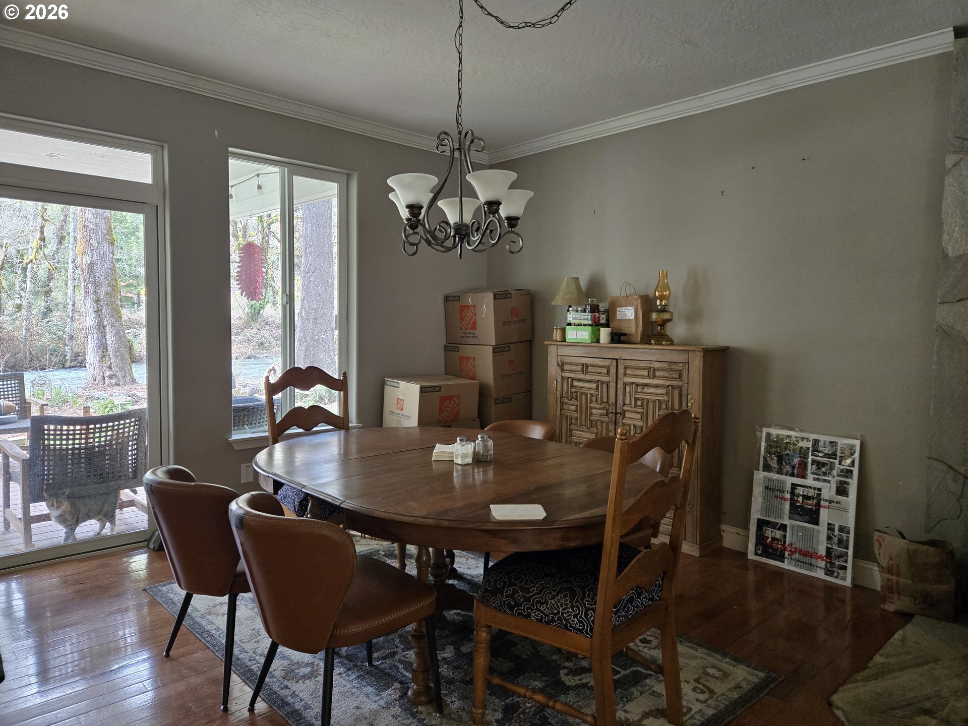 16817 Nonpareil Road Sutherlin, OR 97479 - Photo 10 of 39 a dining room with furniture a chandelier and wooden floor