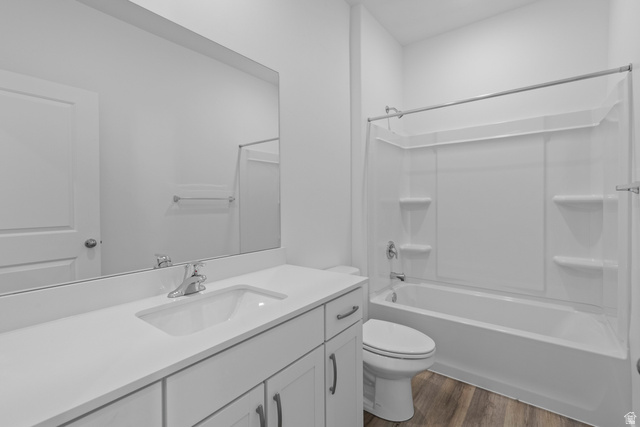2823 North 710 West, Unit 16 Logan, UT 84321 - Photo 6 of 22 Bathroom with vanity, dark wood-type flooring, and shower / tub combination