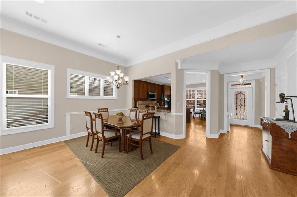 3739 Golden Leaf Point Southwest Gainesville, GA 30504 - Photo 14 of 60 a view of a dining room with furniture and wooden floor