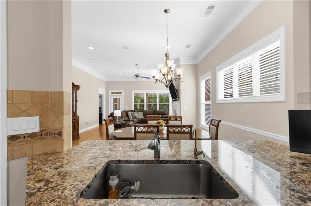 3739 Golden Leaf Point Southwest Gainesville, GA 30504 - Photo 18 of 60 a view of a kitchen with granite countertop a sink and a counter top space