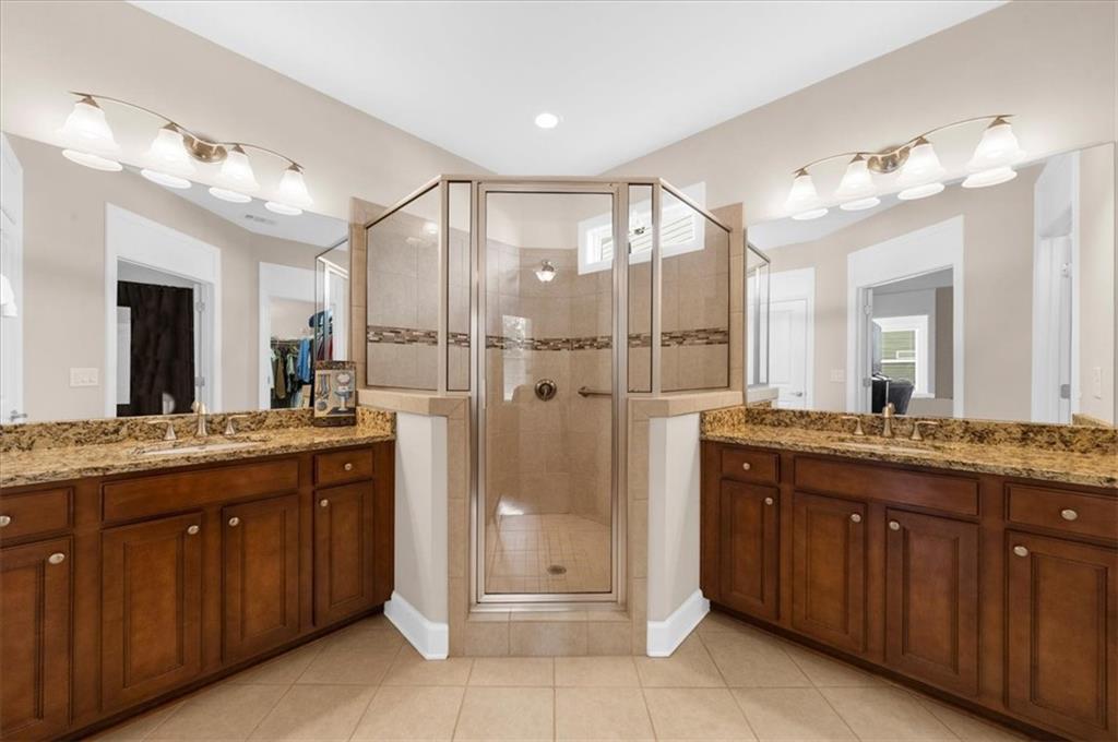 3739 Golden Leaf Point Southwest Gainesville, GA 30504 - Photo 23 of 60 a bathroom with a double vanity sink and a mirror