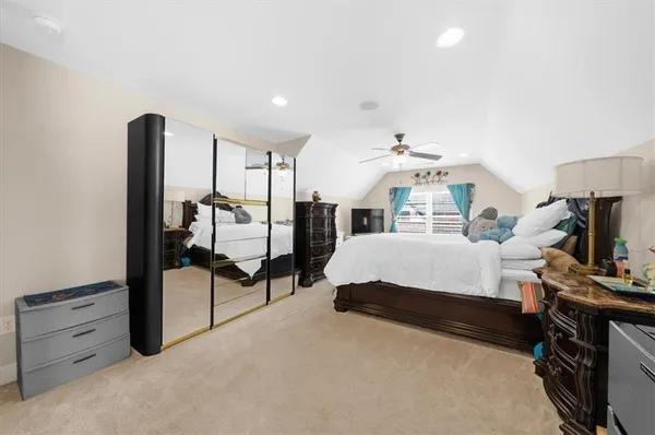 a bed room with a bed and a chandelier