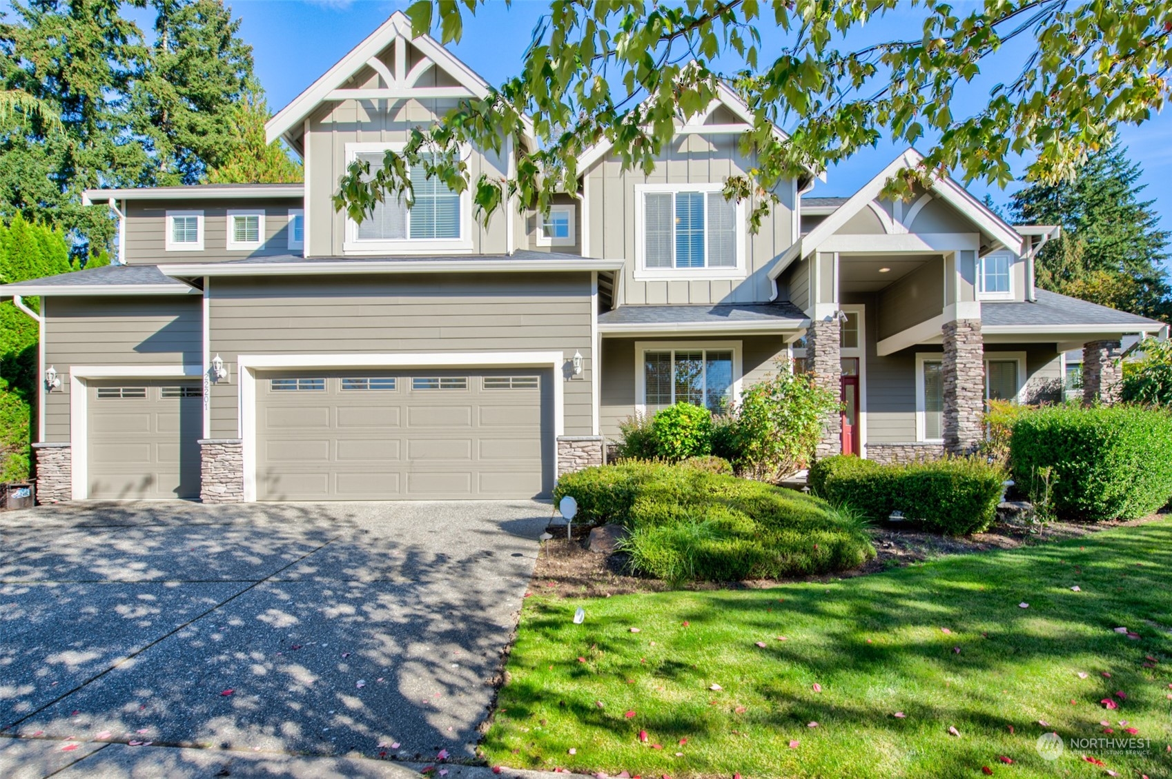22201 32nd Avenue Southeast Bothell, WA 98021 - Photo 1 of 39 a front view of a house with a garden and plants