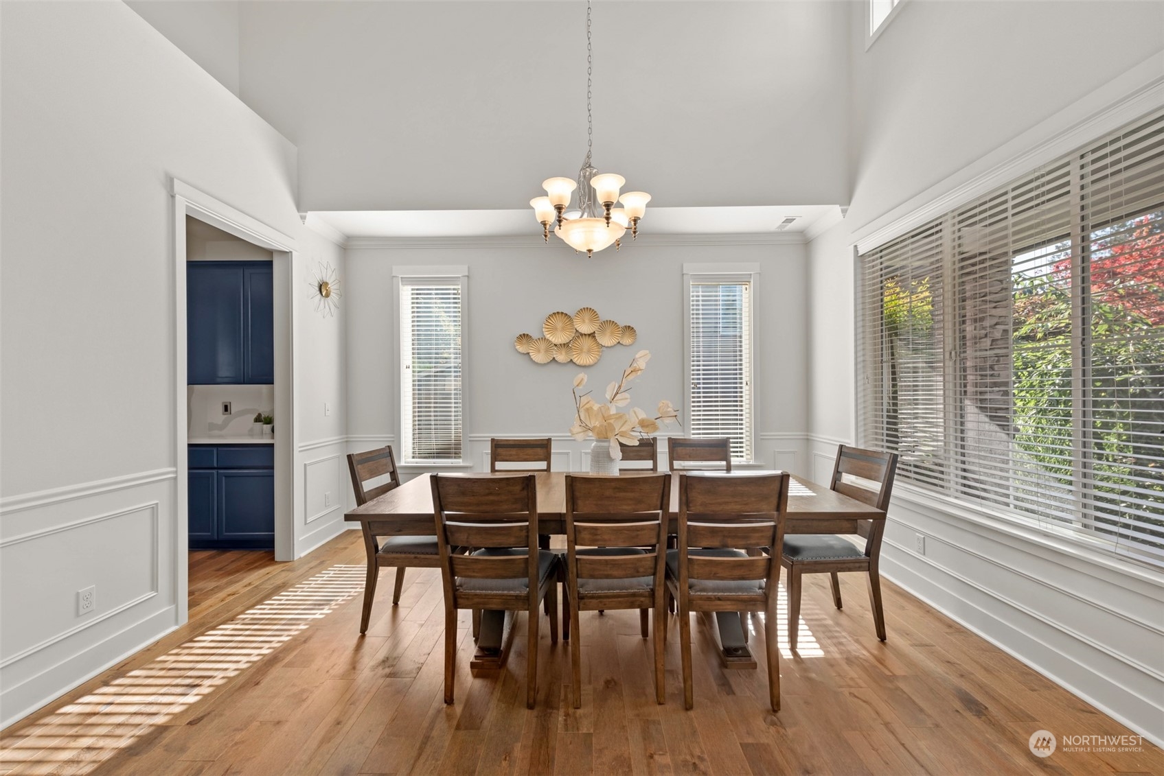 22201 32nd Avenue Southeast Bothell, WA 98021 - Photo 14 of 39 a view of a dining room with furniture wooden floor and chandelier