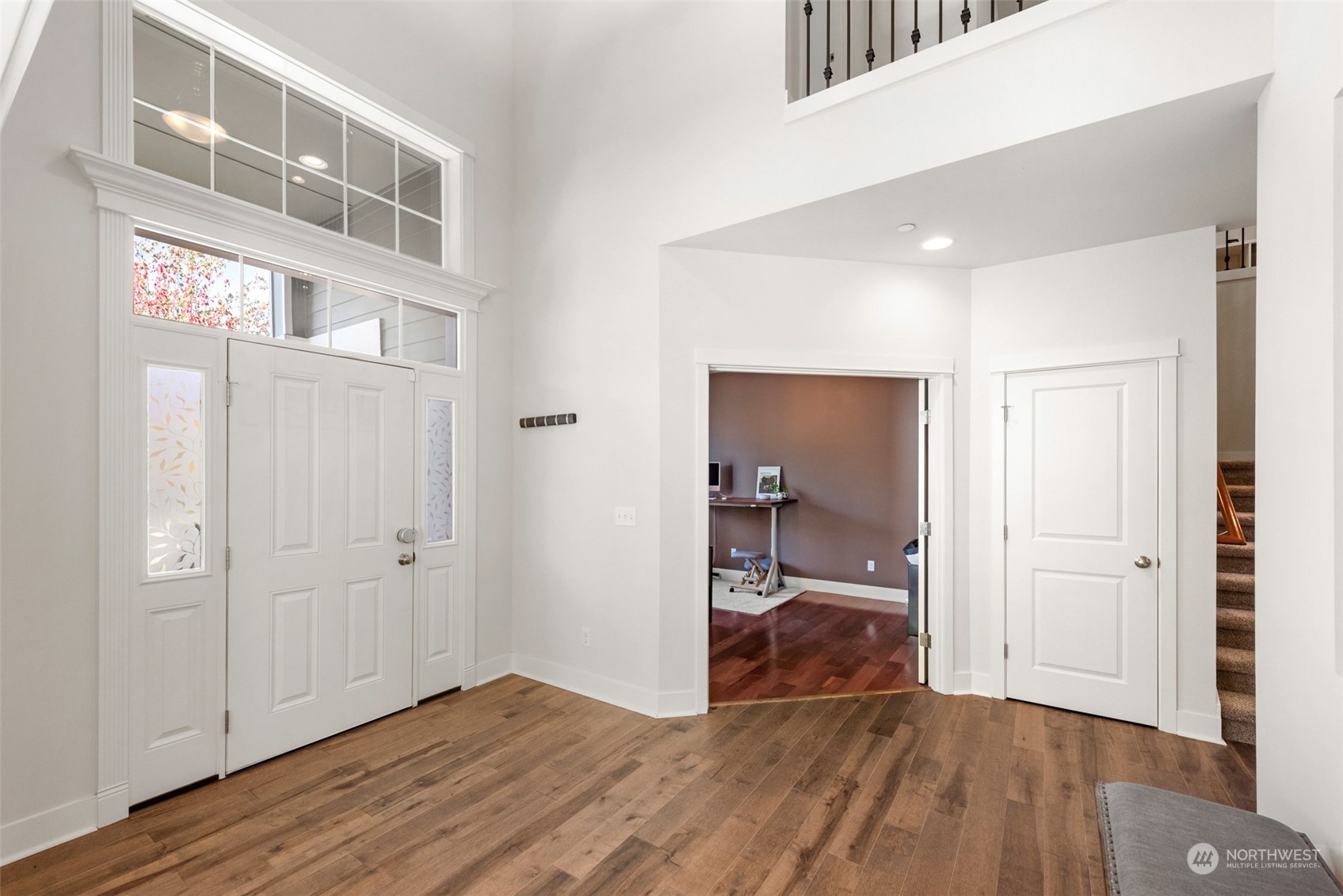 22201 32nd Avenue Southeast Bothell, WA 98021 - Photo 15 of 39 a view of a hallway with wooden floor and a bathroom