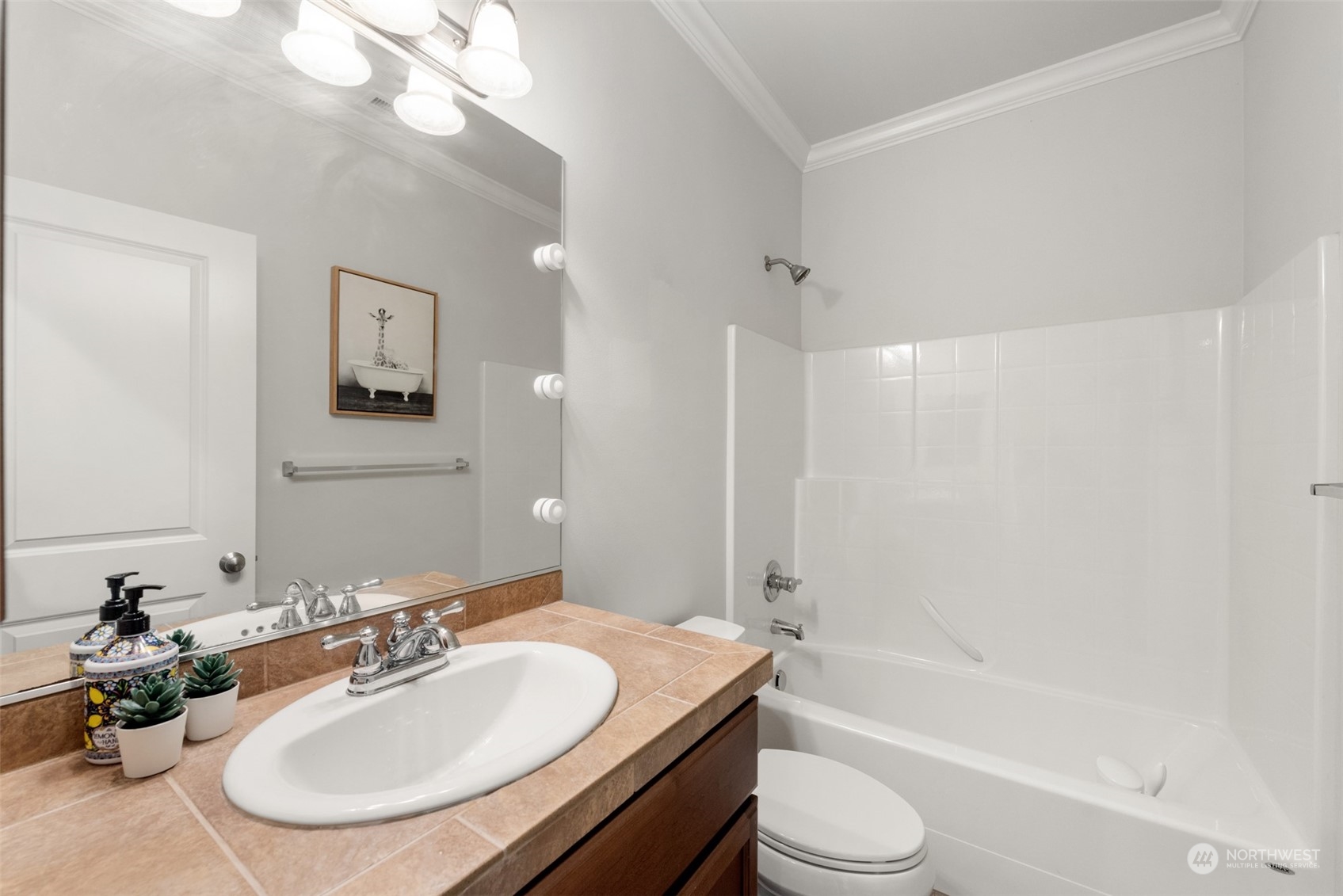 22201 32nd Avenue Southeast Bothell, WA 98021 - Photo 17 of 39 a bathroom with a bathtub shower sink vanity mirror and toilet