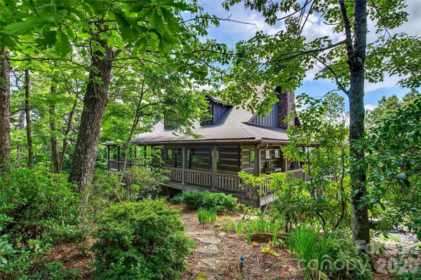 front view of a house with a garden