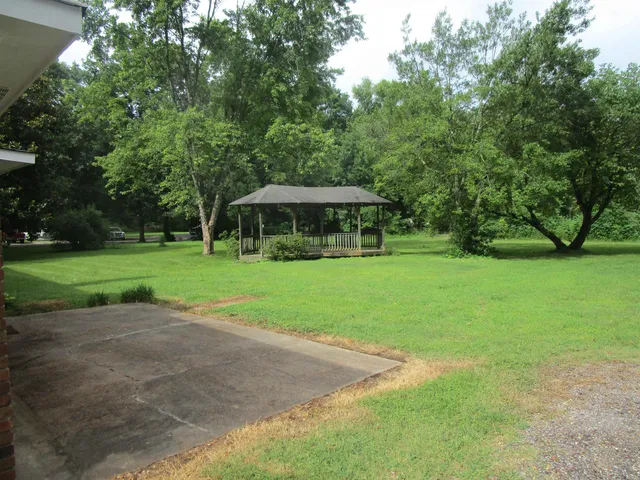 a view of a house with a big yard