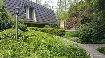 a view of a house with a small yard