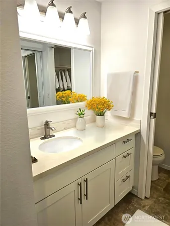 a bathroom with a sink and a mirror