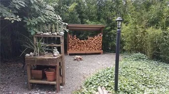 a wooden bench sitting in front of a building