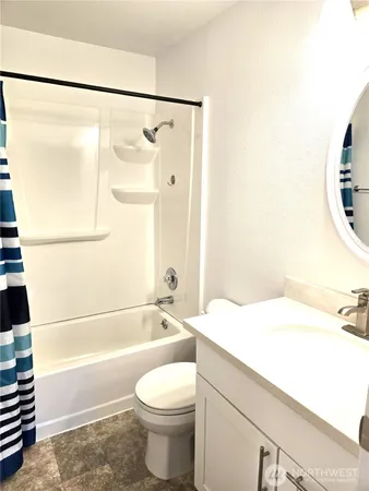 a bathroom with a sink a toilet and a bathtub