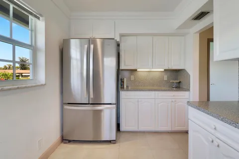 a living room with furniture and a lamp