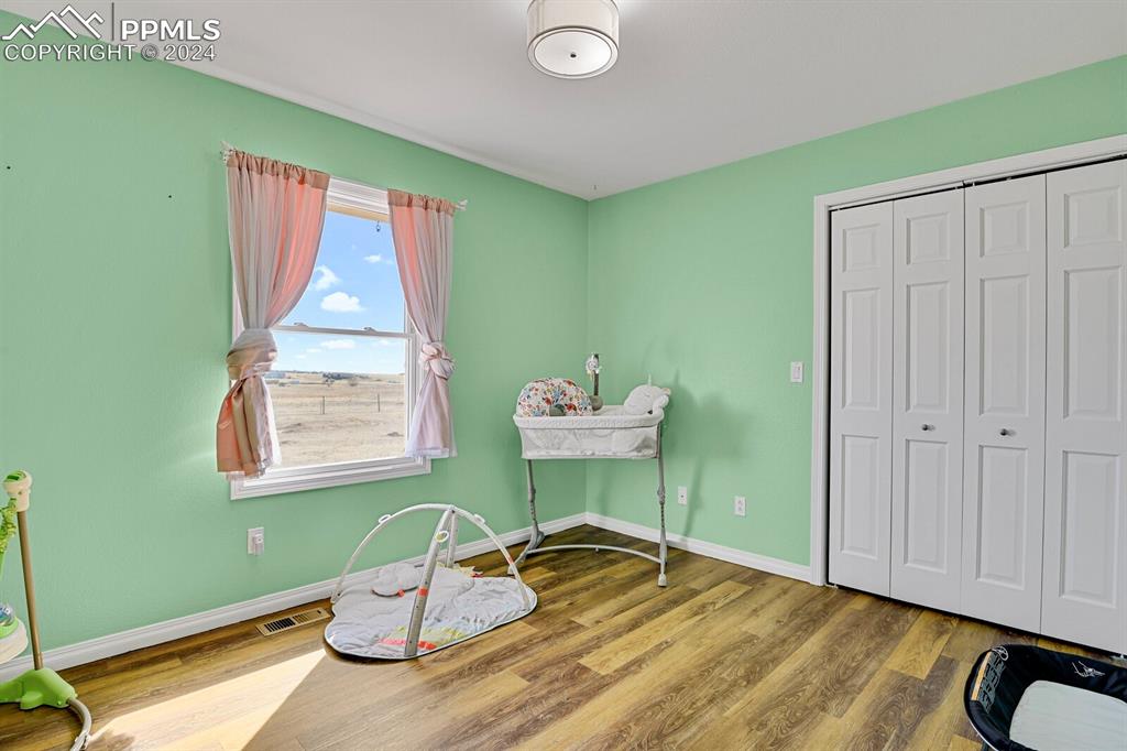 3805 Curtis Road Peyton, CO 80831 - Photo 14 of 36 a room with chair and window