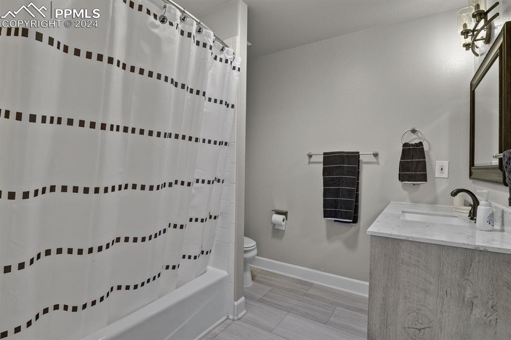 3805 Curtis Road Peyton, CO 80831 - Photo 15 of 36 a bathroom with a bathtub and a shower