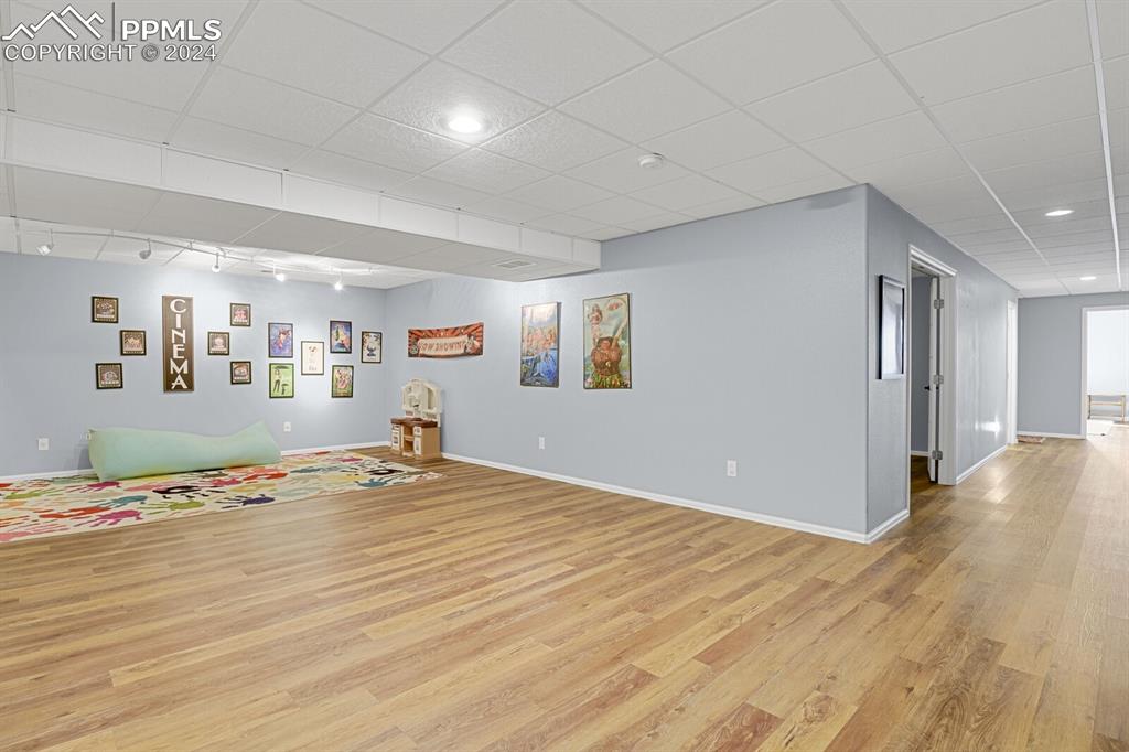 3805 Curtis Road Peyton, CO 80831 - Photo 17 of 36 a view of a livingroom with wooden floor