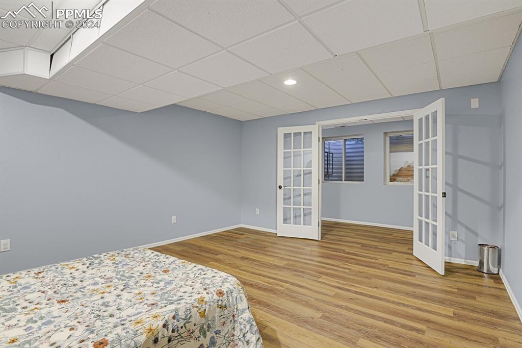 3805 Curtis Road Peyton, CO 80831 - Photo 18 of 36 a view of empty room with wooden floor and fan