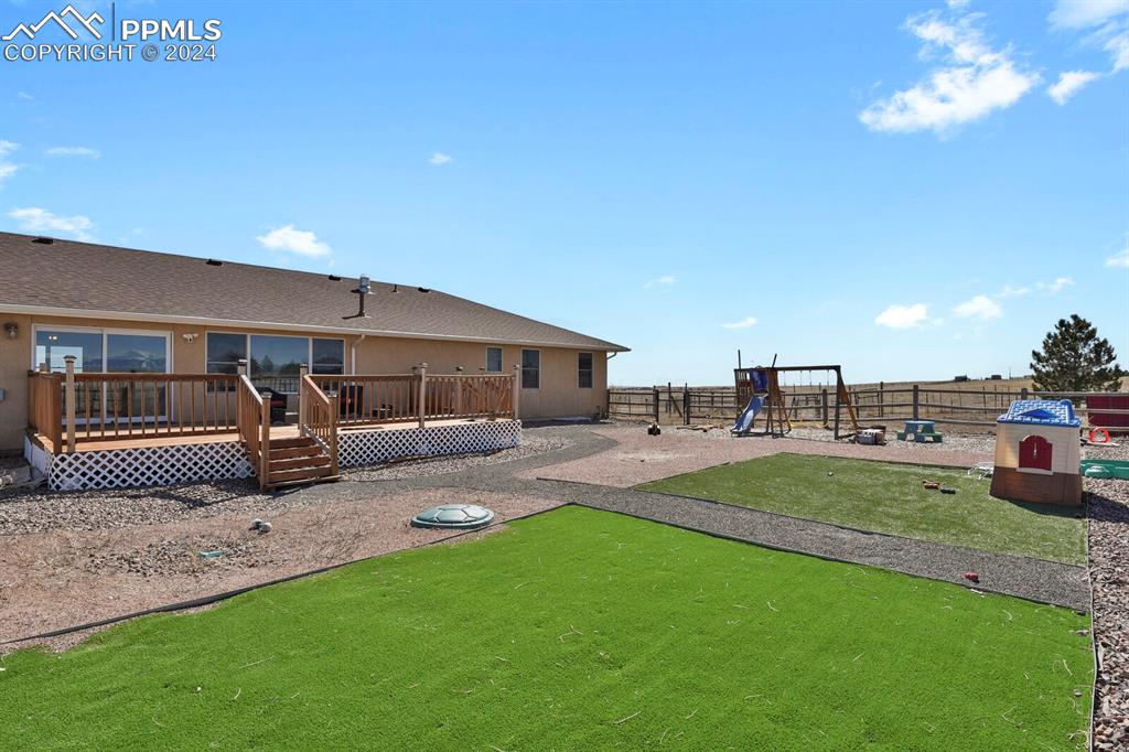 3805 Curtis Road Peyton, CO 80831 - Photo 30 of 36 a view of a house with backyard porch and sitting area