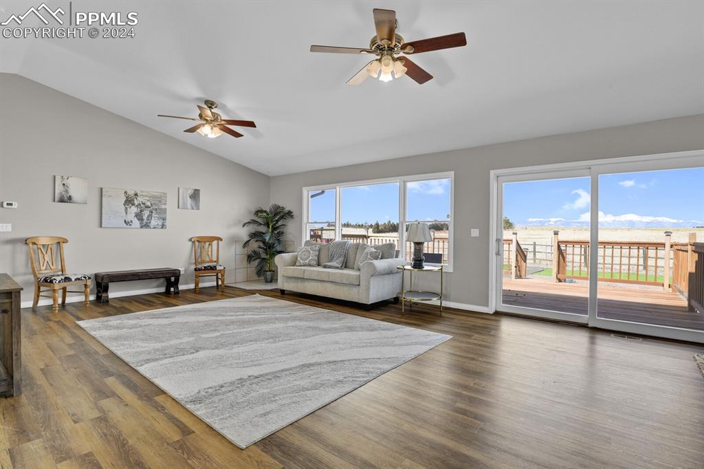 3805 Curtis Road Peyton, CO 80831 - Photo 5 of 36 a living room with furniture and wooden floor
