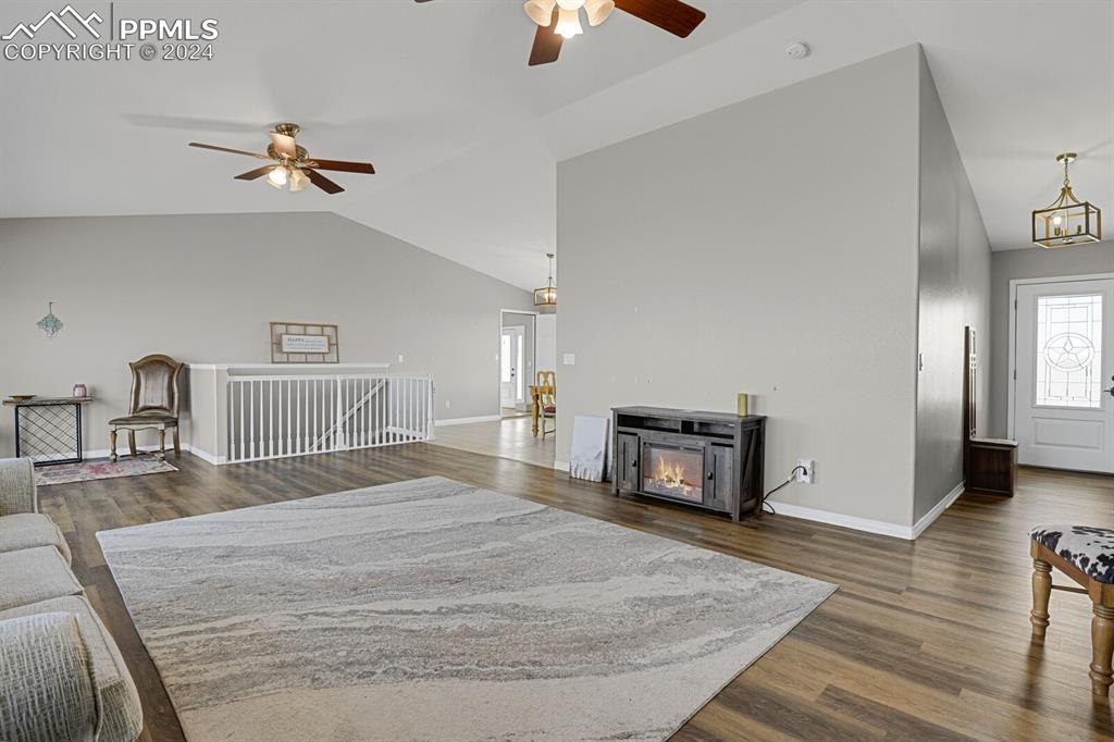 3805 Curtis Road Peyton, CO 80831 - Photo 6 of 36 a bedroom with a bed and wooden floor