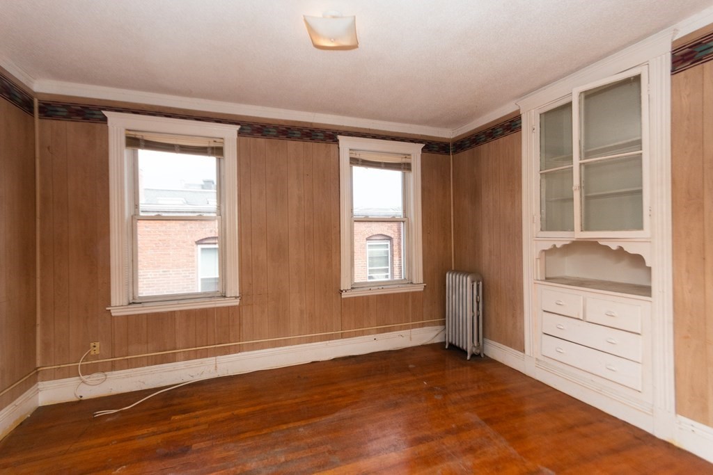 88 Winthrop Street Boston, MA 02119 - Photo 15 of 20 a view of an empty room with a window