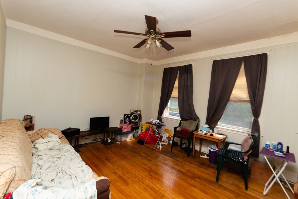 88 Winthrop Street Boston, MA 02119 - Photo 5 of 20 a view of a livingroom with furniture and a rug
