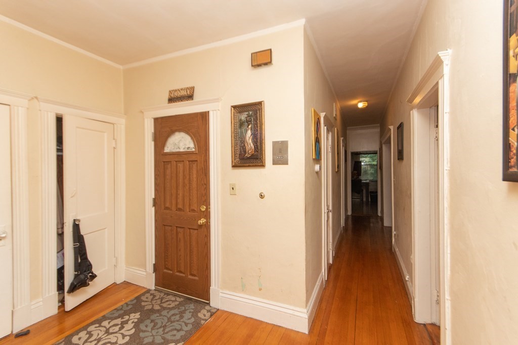 88 Winthrop Street Boston, MA 02119 - Photo 8 of 20 a view of a hallway with bathroom and glass door