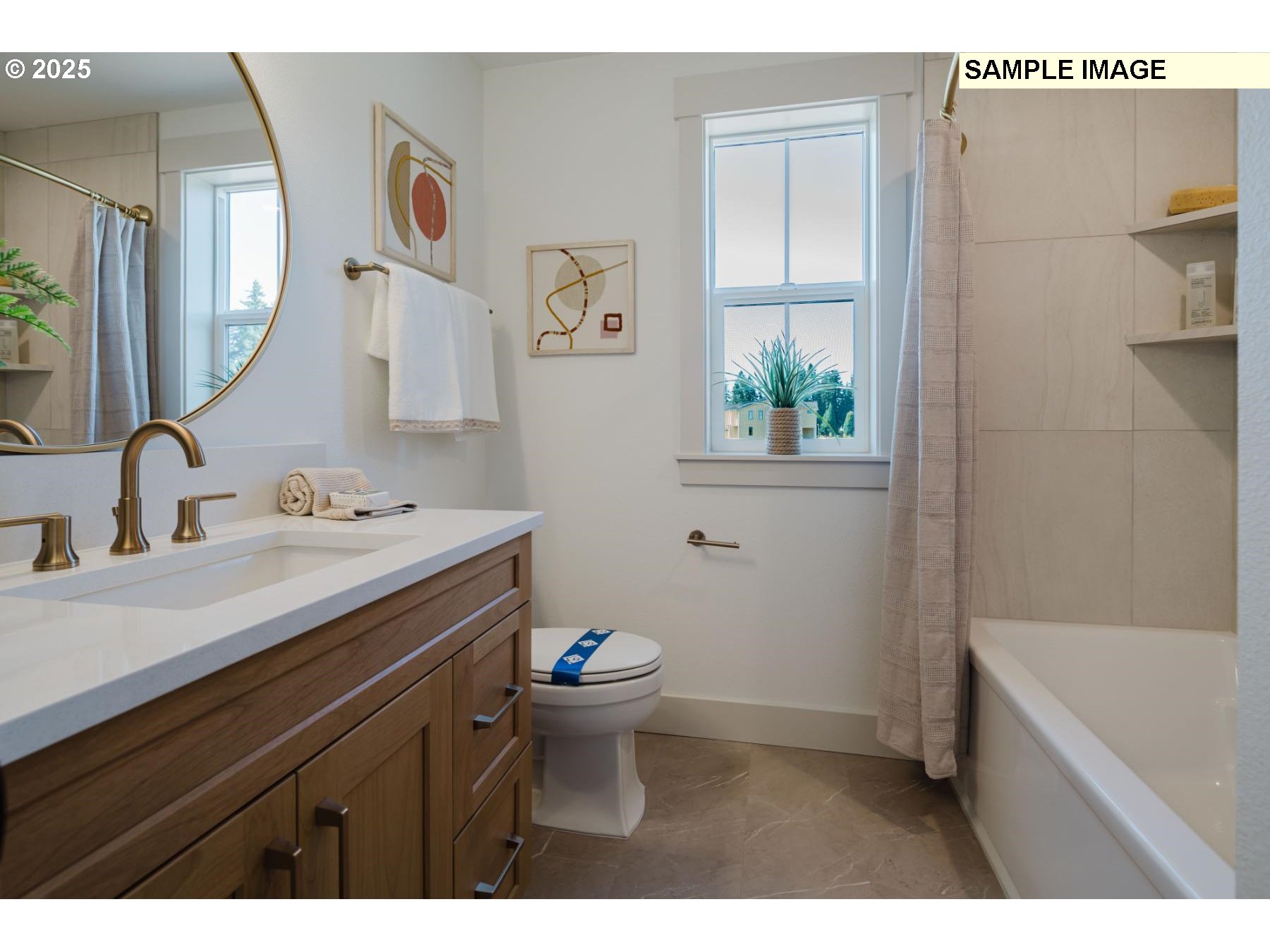 4719 Northwest Camas Meadows Drive Camas, WA 98607 - Photo 16 of 29 a bathroom with a sink a toilet and shower