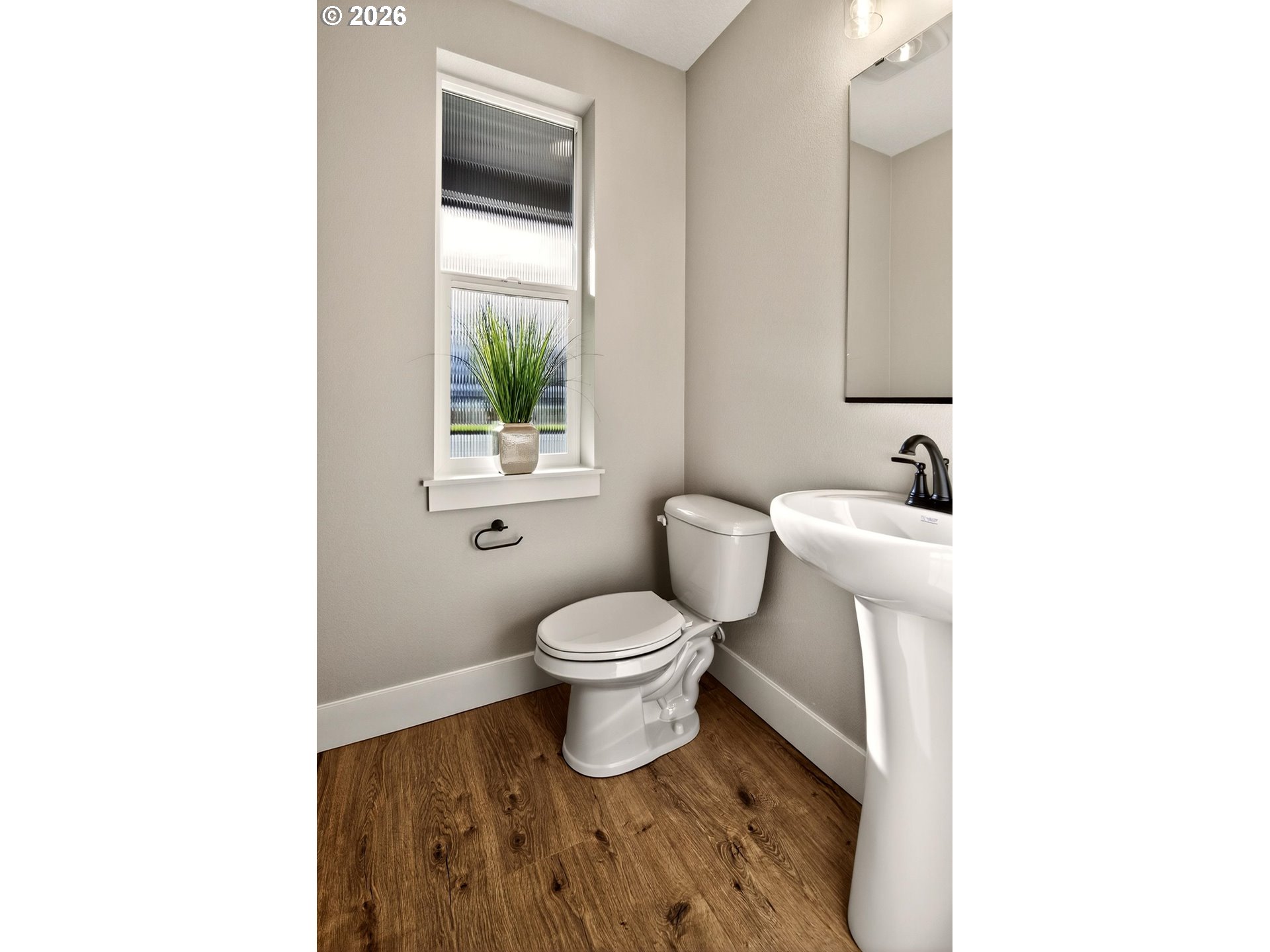 4719 Northwest Camas Meadows Drive Camas, WA 98607 - Photo 24 of 29 a bathroom with a toilet a sink a vanity and mirror