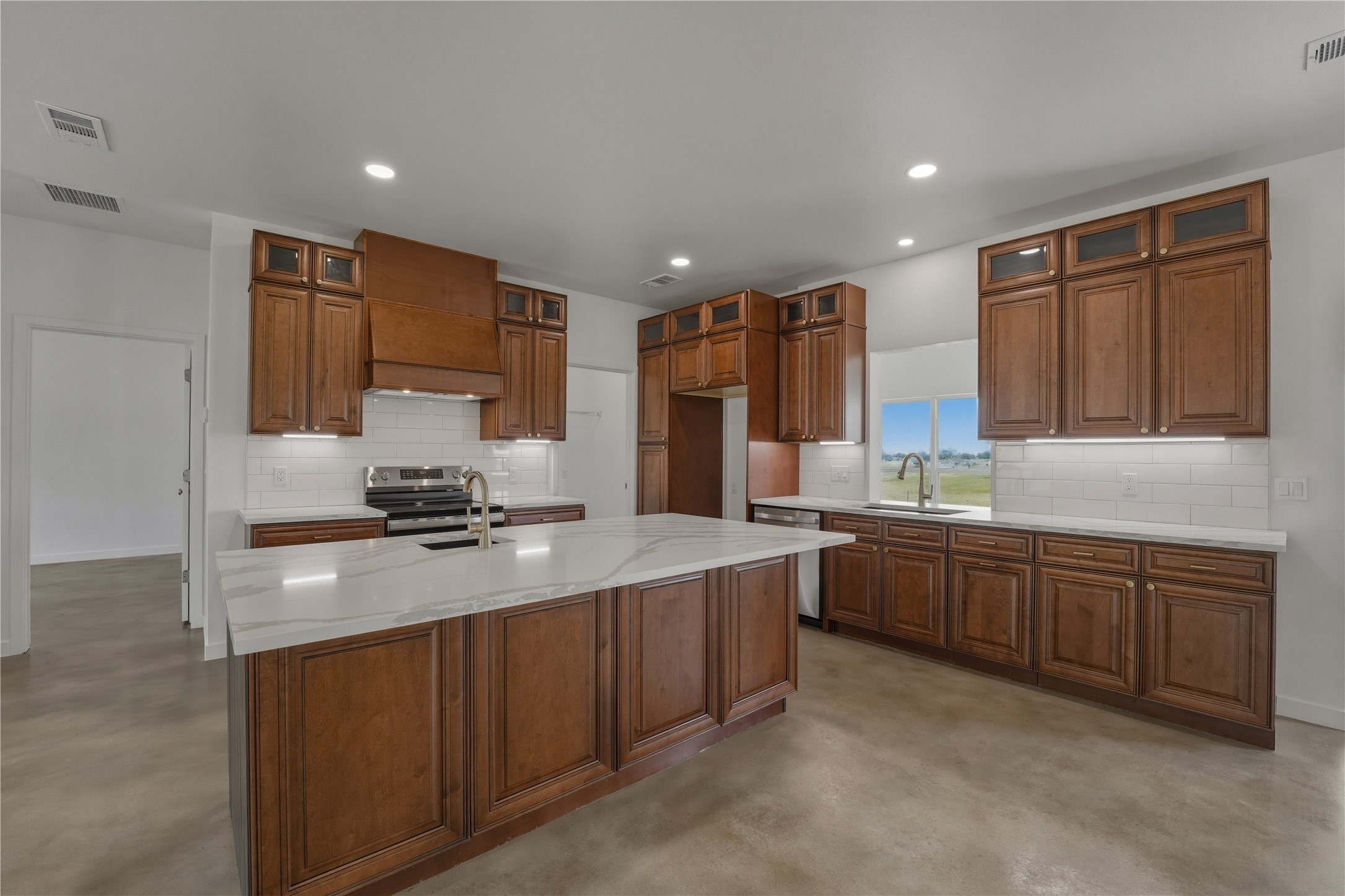 9345 Hajovsky Road La Grange, TX 78945 - Photo 2 of 24 outdoor kitchen with stainless steel appliances granite countertop a sink stove and refrigerator